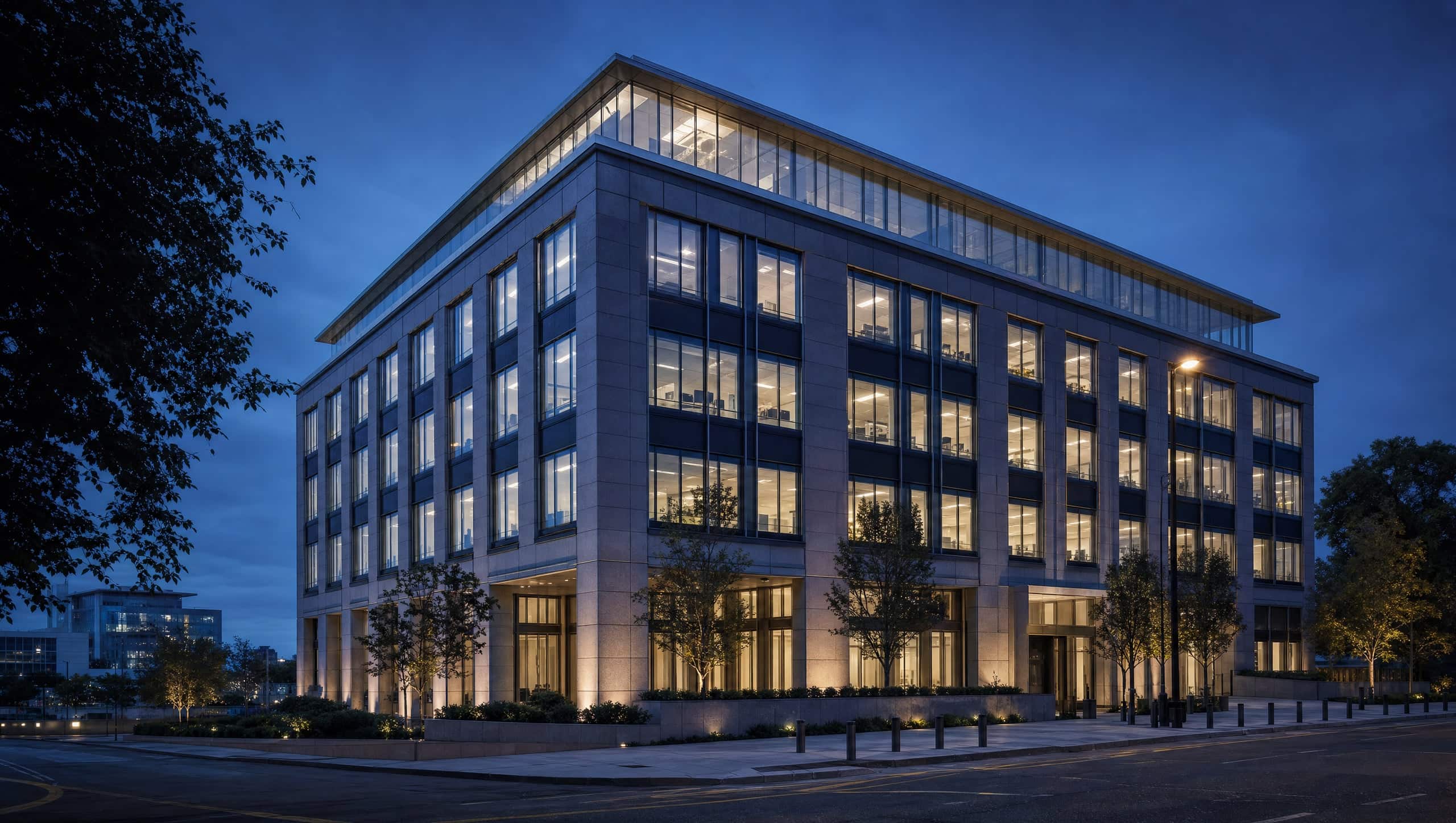 Office building at dusk with its windows lit